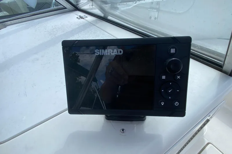 Slide: The Image of Simrad marine display on 2001 Aquasport 215 Osprey Sport boat dashboard. - 10