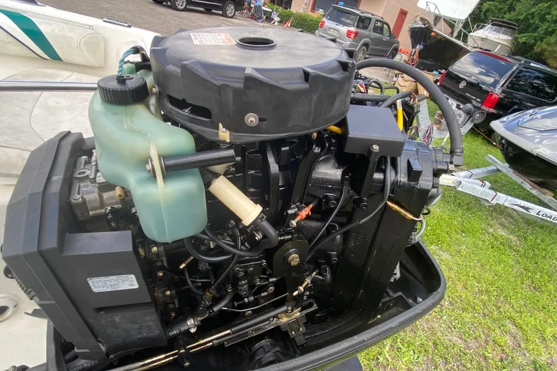 Slide: The Image of Outboard motor of a 2001 Aquasport 215 Osprey Sport boat, detailed view. - 15