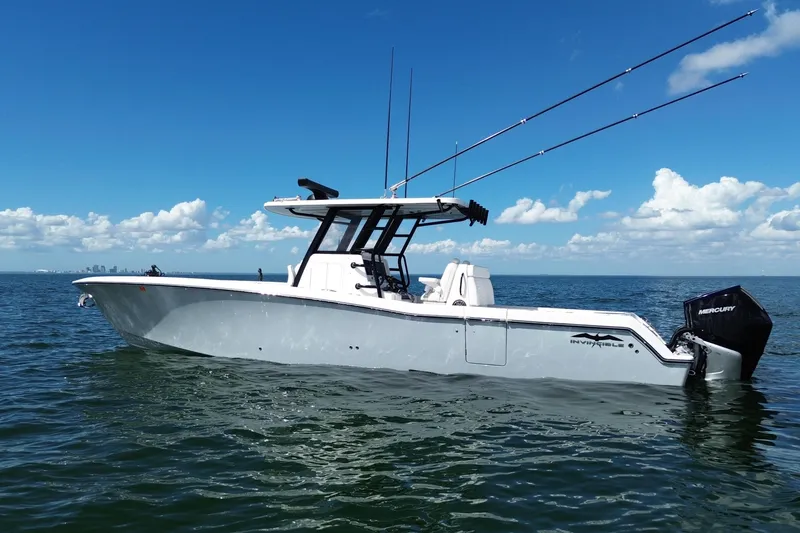 The Image of 2024 Invincible 36 Open Fisherman boat on calm ocean under blue sky. - 1