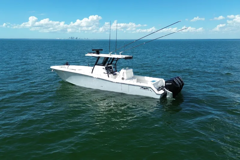 Slide: The Image of 2024 Invincible 36 Open Fisherman boat on calm ocean waters under blue sky. - 11