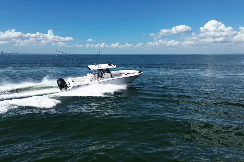 Slide: The Image of 2024 Invincible 36 Open Fisherman speeding on ocean under clear blue sky. - 12