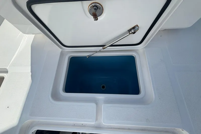 Slide: The Image of Open storage compartment on 2024 Invincible 36 Open Fisherman boat. - 18