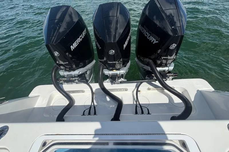 Slide: The Image of Triple Mercury Verado engines on a 2024 Invincible 36 Open Fisherman boat. - 21