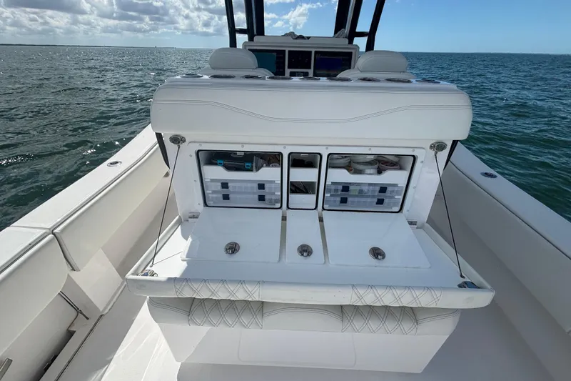 Slide: The Image of 2024 Invincible 36 Open Fisherman boat with storage compartments on open sea. - 24