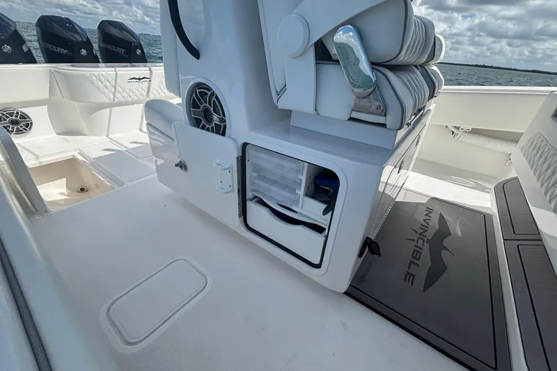 Slide: The Image of 2024 Invincible 36 Open Fisherman boat interior with storage compartments and seating. - 25