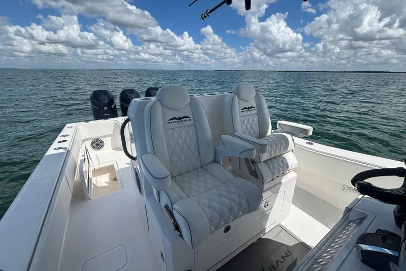 Slide: The Image of 2024 Invincible 36 Open Fisherman boat interior with luxurious seating on open water. - 26