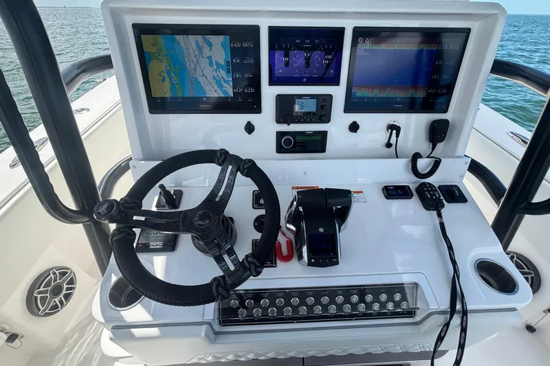 Slide: The Image of 2024 Invincible 36 Open Fisherman helm with advanced navigation displays and controls. - 28