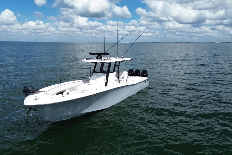 Slide: The Image of 2024 Invincible 36 Open Fisherman boat on calm ocean waters under a cloudy sky. - 3