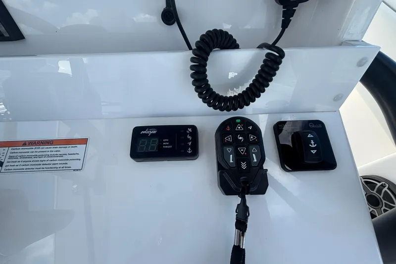 Slide: The Image of Control panel of 2024 Invincible 36 Open Fisherman boat with warning label. - 34