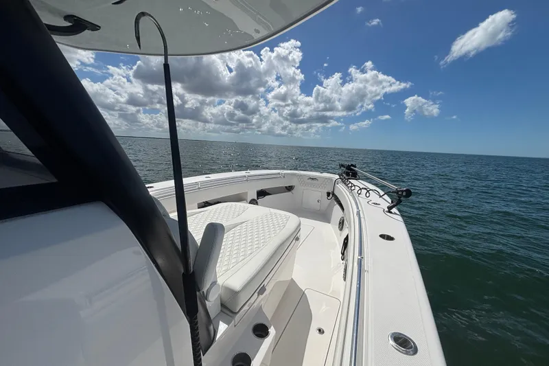 Slide: The Image of 2024 Invincible 36 Open Fisherman boat on open sea under blue sky. - 35