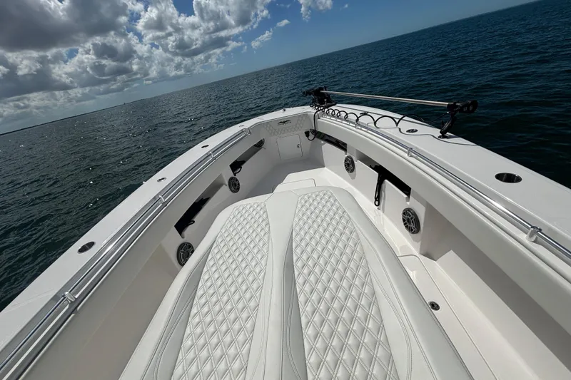 Slide: The Image of 2024 Invincible 36 Open Fisherman boat on open water under cloudy sky. - 36