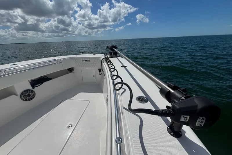 Slide: The Image of 2024 Invincible 36 Open Fisherman boat on open water under a cloudy sky. - 37