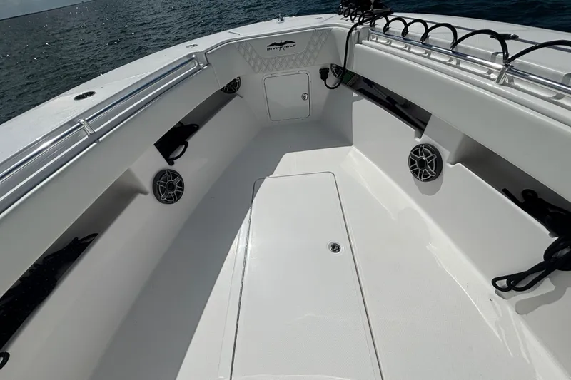 Slide: The Image of 2024 Invincible 36 Open Fisherman boat interior with speakers and storage compartments. - 38