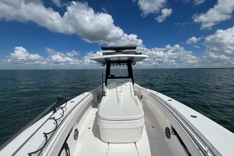 Slide: The Image of 2024 Invincible 36 Open Fisherman boat on open water under a cloudy sky. - 43