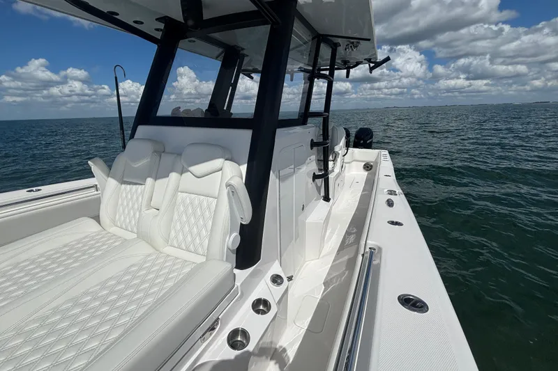 Slide: The Image of 2024 Invincible 36 Open Fisherman boat with luxurious seating on open water. - 48