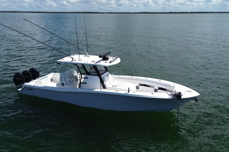 Slide: The Image of 2024 Invincible 36 Open Fisherman boat on calm water, featuring multiple outboard engines. - 5