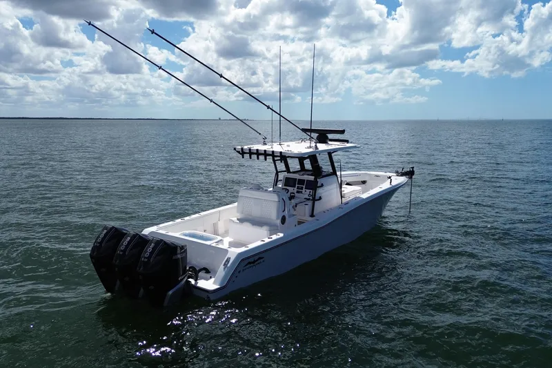 Slide: The Image of 2024 Invincible 36 Open Fisherman boat on calm ocean waters under cloudy sky. - 7