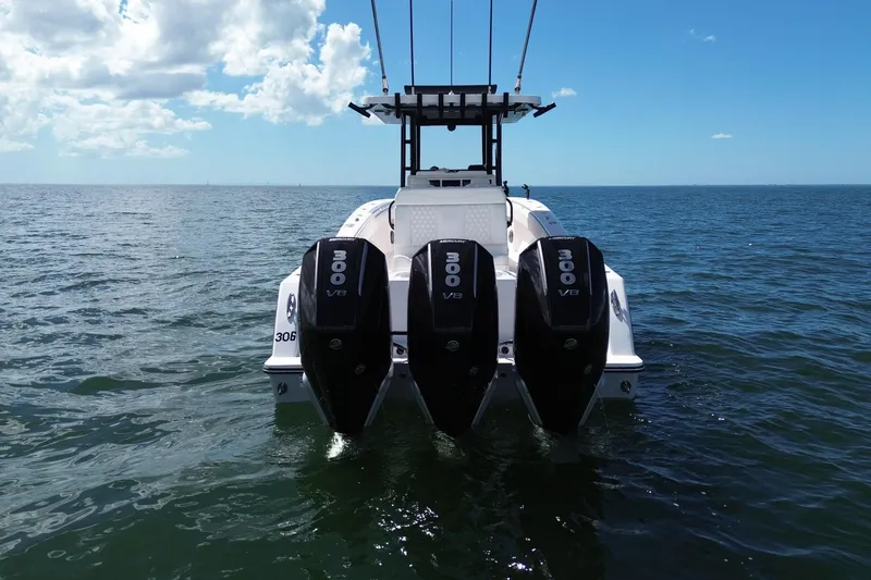 Slide: The Image of 2024 Invincible 36 Open Fisherman with triple 300 V8 engines on open sea. - 8