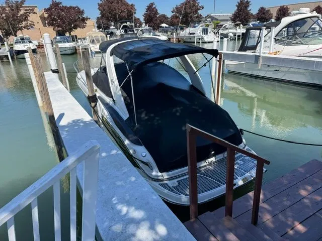 Slide: The Image of 2005 Crownline 270 CR boat docked at marina. - 6