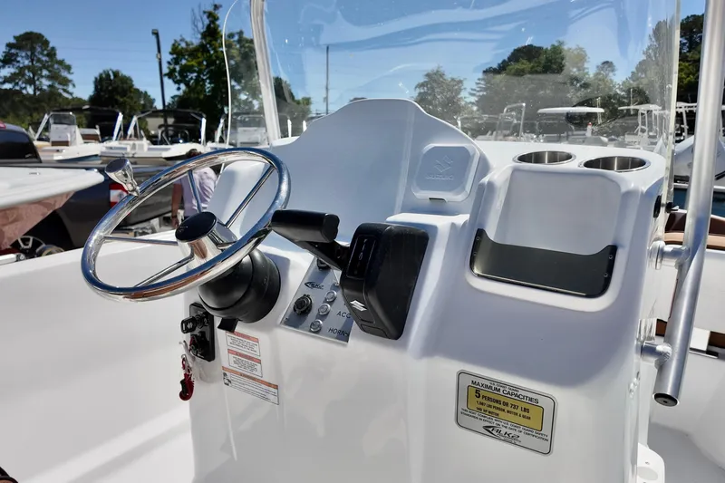 Slide: The Image of 2026 ALK2 Powerboats 18 CRS dashboard with steering wheel and controls. - 3