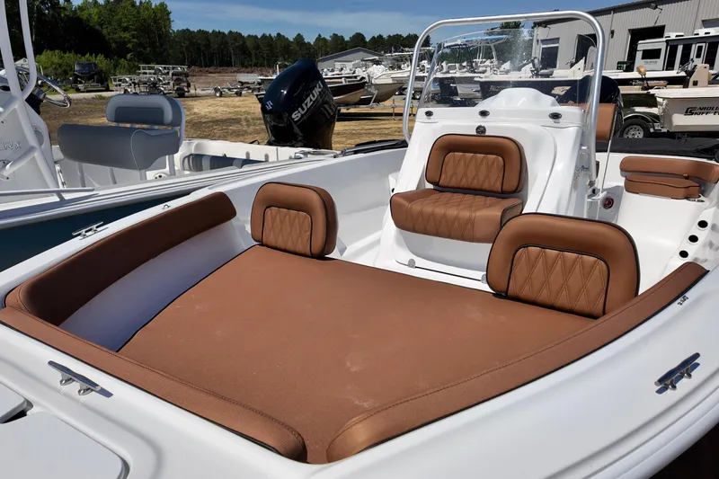 Slide: The Image of 2026 ALK2 Powerboats 18 CRS interior with brown leather seating and modern design. - 7