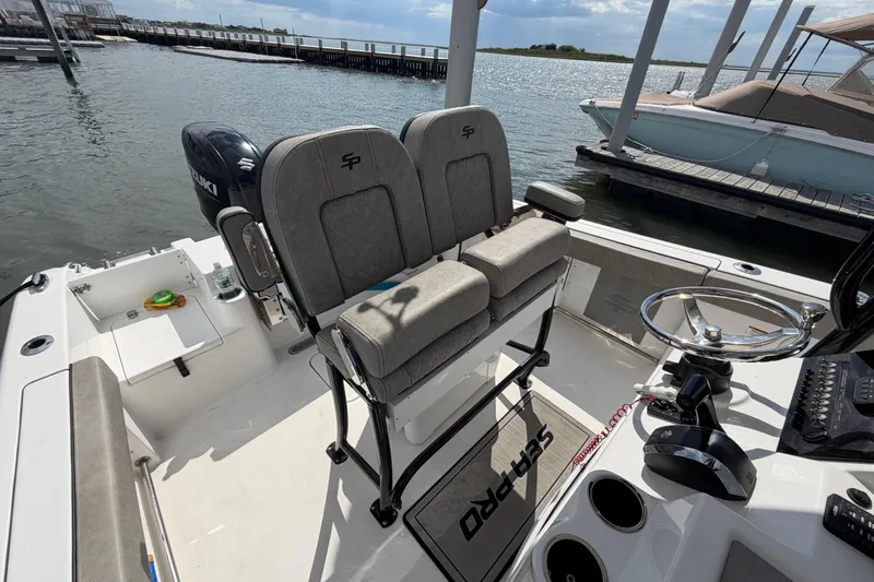 Slide: The Image of 2022 Sea Pro 219 Deep V CC boat interior with dual seats and steering wheel. - 14