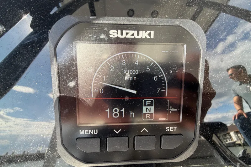 Slide: The Image of Suzuki engine display on 2022 Sea Pro 219 Deep V CC boat, showing 181 hours. - 16