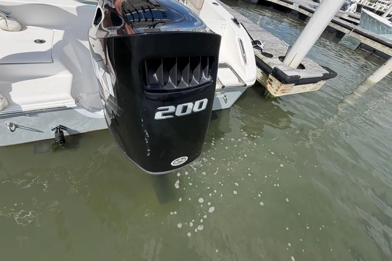 Slide: The Image of Outboard motor on 2022 Sea Pro 219 Deep V CC boat docked in marina. - 31