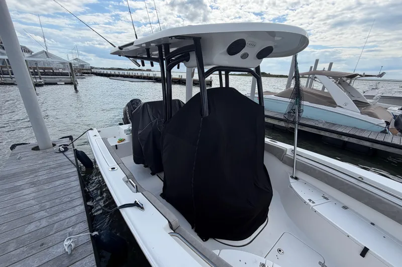 Slide: The Image of 2022 Sea Pro 219 Deep V CC boat docked at marina under cloudy sky. - 6