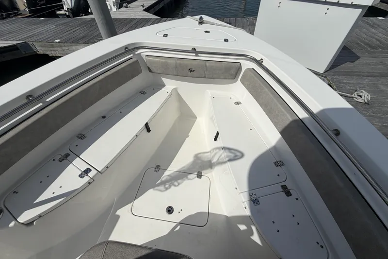 Slide: The Image of 2022 Sea Pro 219 Deep V CC boat interior with seating and storage compartments. - 7