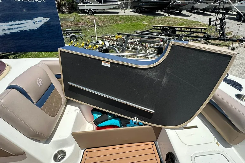 Slide: The Image of 2019 Hurricane Sundeck Sport 218 OB boat interior with seating and storage compartment open. - 10