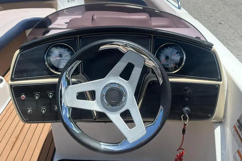 Slide: The Image of Steering wheel and dashboard of 2019 Hurricane Sundeck Sport 218 OB boat. - 15