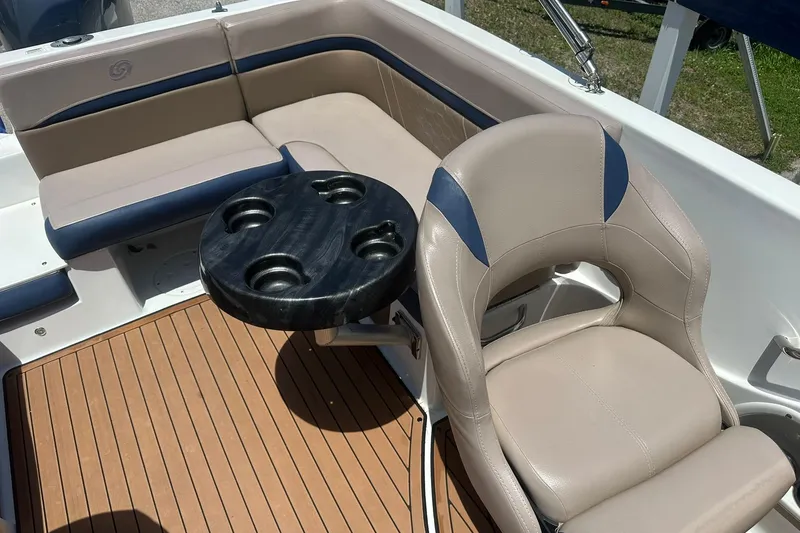 Slide: The Image of Interior of 2019 Hurricane Sundeck Sport 218 OB with seating and cupholder table. - 20