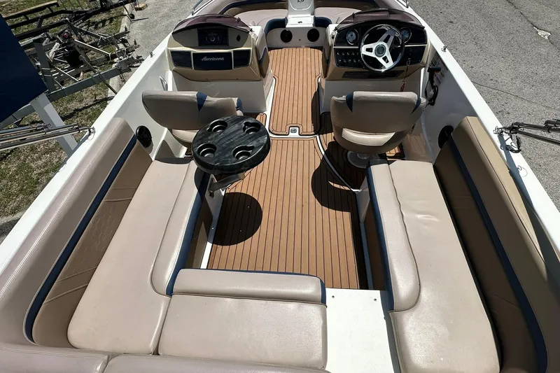 Slide: The Image of 2019 Hurricane Sundeck Sport 218 OB interior with seating and steering wheel. - 25