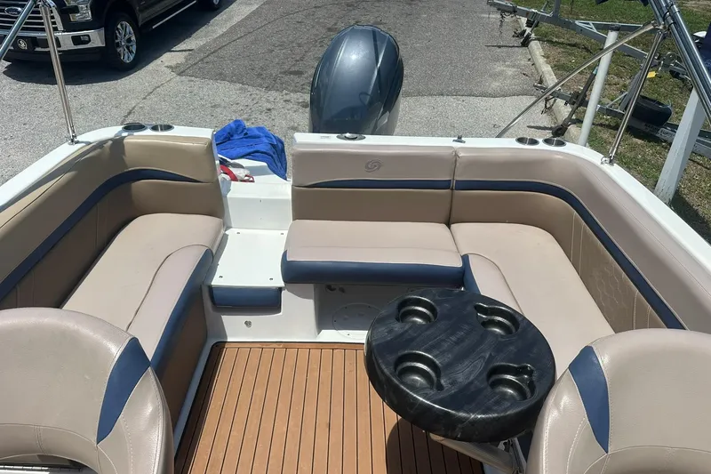 Slide: The Image of 2019 Hurricane Sundeck Sport 218 OB boat interior with seating and table. - 26