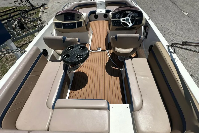 Slide: The Image of 2019 Hurricane Sundeck Sport 218 OB boat interior with seating and steering console. - 29