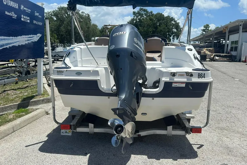 Slide: The Image of 2019 Hurricane Sundeck Sport 218 OB boat on trailer with Yamaha outboard motor. - 30