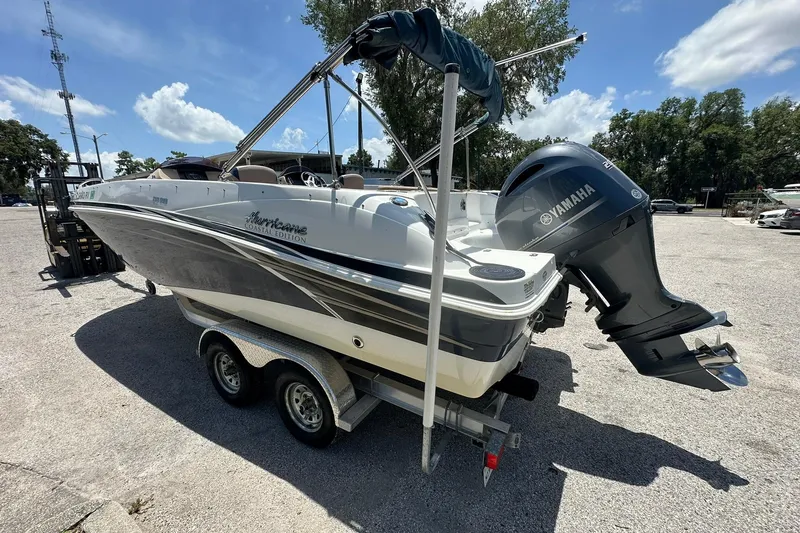Slide: The Image of 2019 Hurricane Sundeck Sport 218 OB boat with Yamaha outboard motor on trailer. - 33