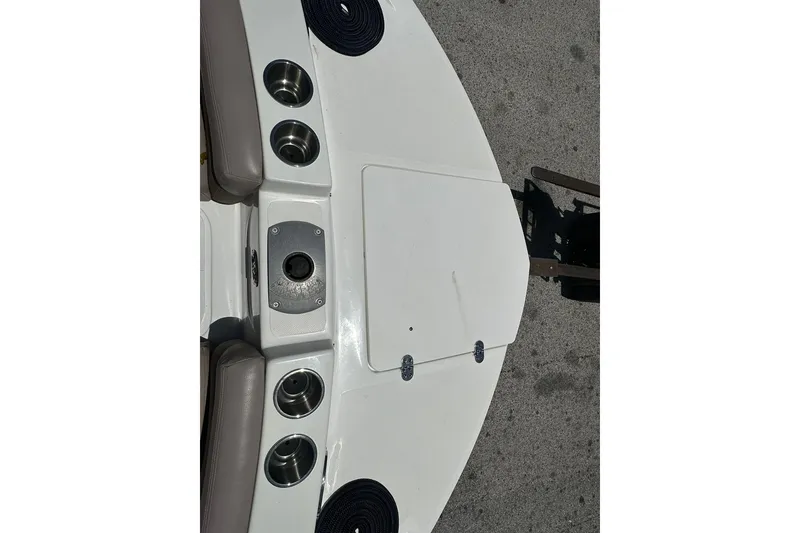Slide: The Image of 2019 Hurricane Sundeck Sport 218 OB boat deck with cup holders and storage compartments. - 4