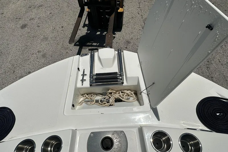 Slide: The Image of 2019 Hurricane Sundeck Sport 218 OB boat deck with storage compartment open. - 5