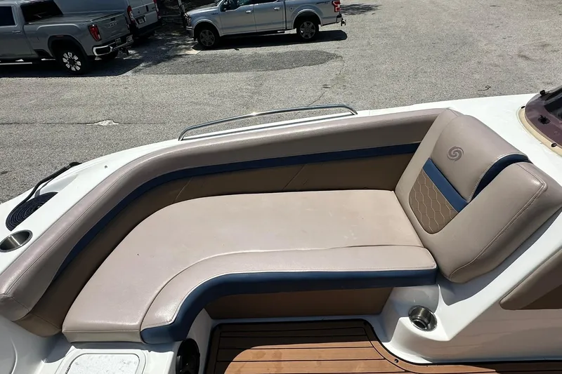 Slide: The Image of 2019 Hurricane Sundeck Sport 218 OB boat interior with beige seating and blue accents. - 8