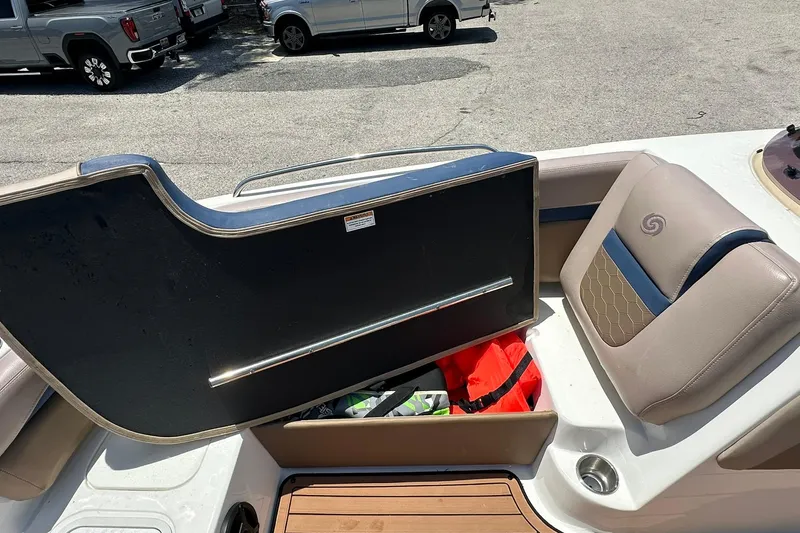 Slide: The Image of 2019 Hurricane Sundeck Sport 218 OB boat interior with storage compartment open. - 9