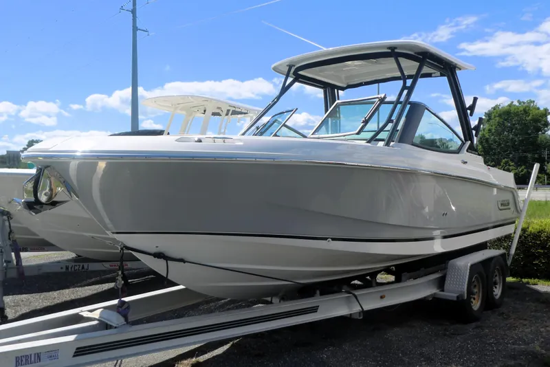 The Image of 2026 Boston Whaler 240 Vantage boat on trailer under clear blue sky. - 0