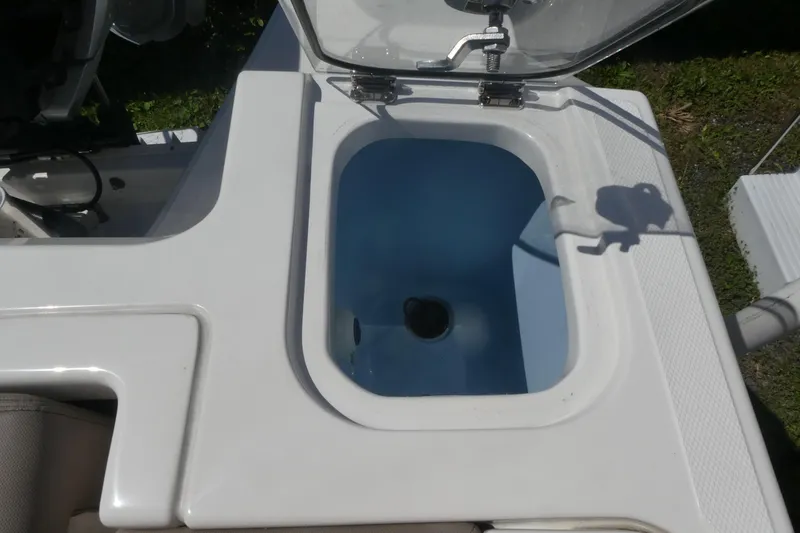Slide: The Image of Livewell on a 2026 Boston Whaler 240 Vantage boat, open lid, sunny day. - 13