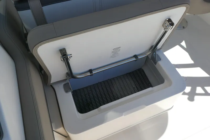 Slide: The Image of Open storage compartment on 2026 Boston Whaler 240 Vantage boat. - 9