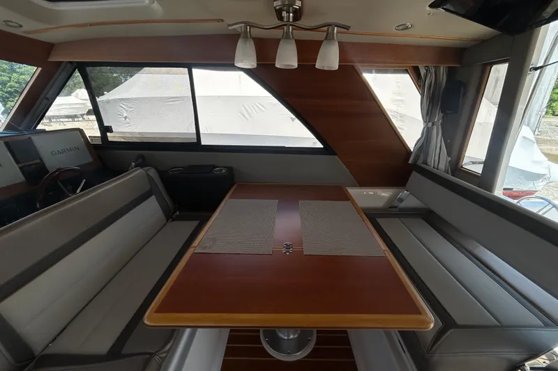 Slide: The Image of Interior of 2022 Cutwater C-30 CB boat with seating and dining table. - 8