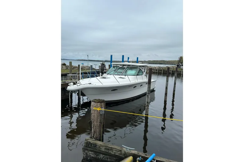 The Image of 2004 Tiara Yachts 3200 Open docked at a marina on a cloudy day. - 0