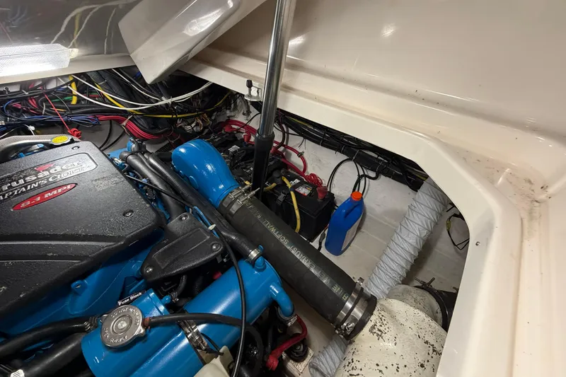 Slide: The Image of Engine compartment of a 2004 Tiara Yachts 3200 Open, showcasing wiring and components. - 18
