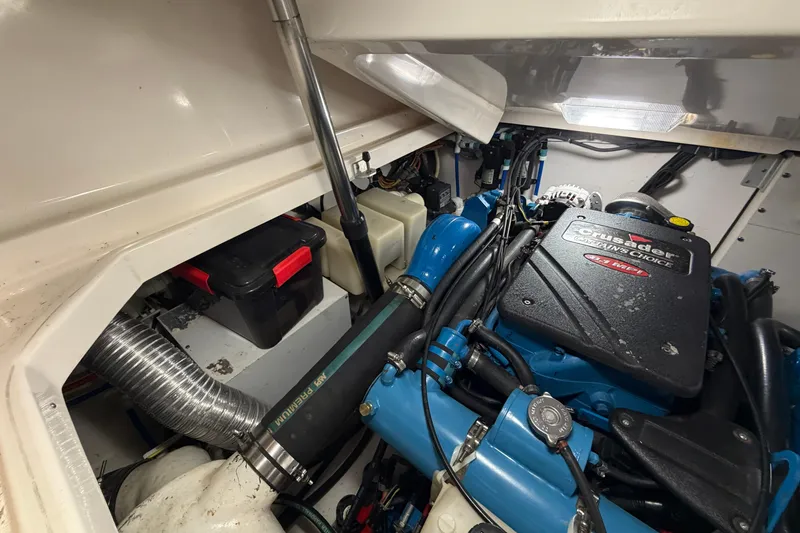 Slide: The Image of Engine compartment of a 2004 Tiara Yachts 3200 Open, featuring a Crusader engine. - 18