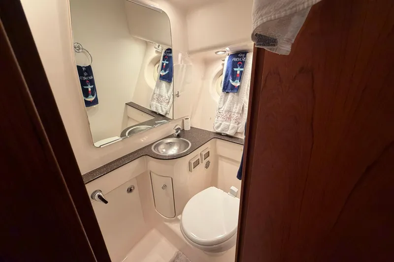 Slide: The Image of Bathroom interior of 2004 Tiara Yachts 3200 Open, featuring sink and toilet. - 23